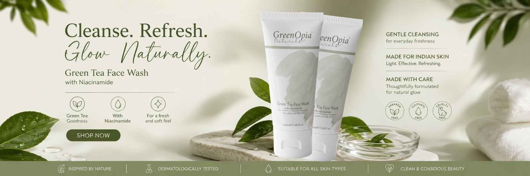 Two white tubes of GreenOpa Green Tea Face Wash displayed on a light beige background with decorative green leaves, a stone bowl, and soft-focus botanical elements. Text on the left reads 'Cleanse.